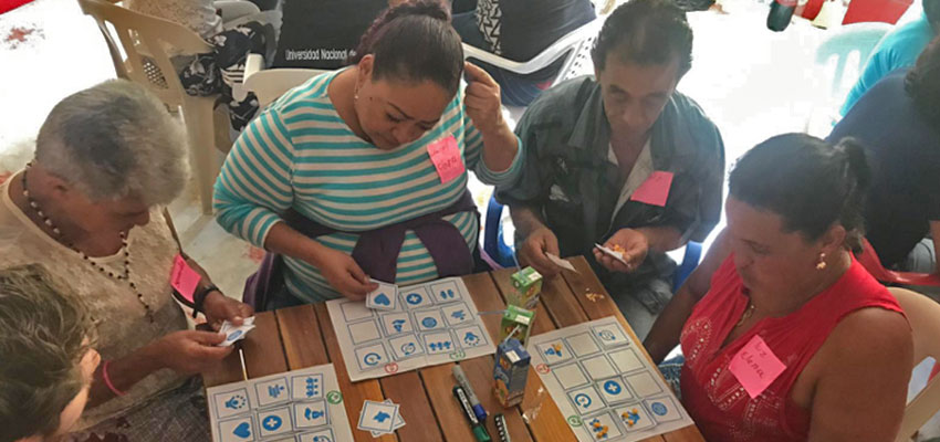 A Bingo game helps women identify benefits and challenges in their coffee and mining activities. Santa Rita, Colombia, January 2019.