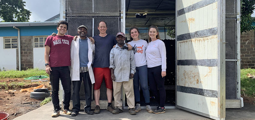Left to right: Alex Encinas, MIT junior in mechanical engineering; Mwachoni El-Yahkim of the University of Nairobi; Eric Verploegen, research engineer at MIT D-Lab; Boniface Manambo of the University of Nairobi; Christine Padalino, MIT junior in chemical engineering; and Madeline Bundy, MIT senior in chemical engineering, stand in front of an evaporative cooling chamber they built at the University of Nairobi in Kenya. Credits: Photo courtesy of MIT D-Lab 