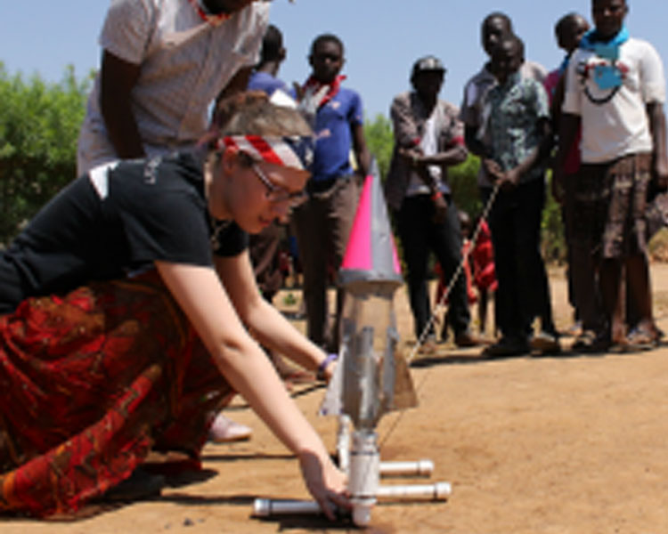 Jim (Makerere Universit) and Maddie Haas prepare a bottle rocket for launch. (Photo: Lauren Bustamente)