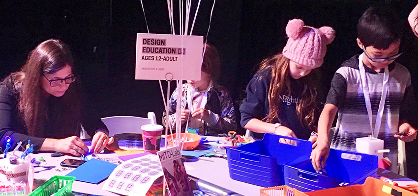 D-Lab Program Associate Melissa Mangino (right) helps visitors young and old prototype fanciful battery-powered LED lights at the Cooper Hewitt National Design Week Design Fest.