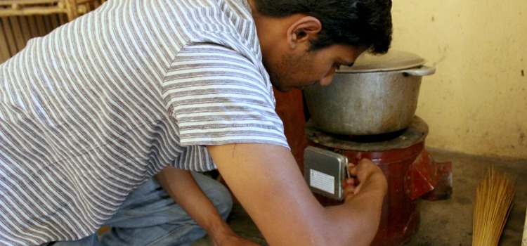 Prithvi adjusts a Sensen cookstove sensor in Uganda, 2015.