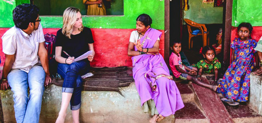 Carolne Morris and Pranav conducting an interview with a smallholder woman farmer.