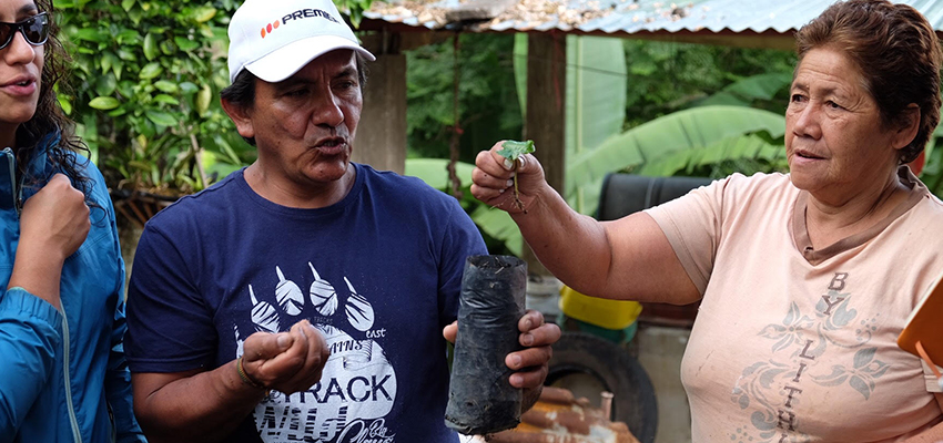 Carlitos and Maria, cofounders of Aprenat, show D-Lab students the coffee growing process. January 2018.