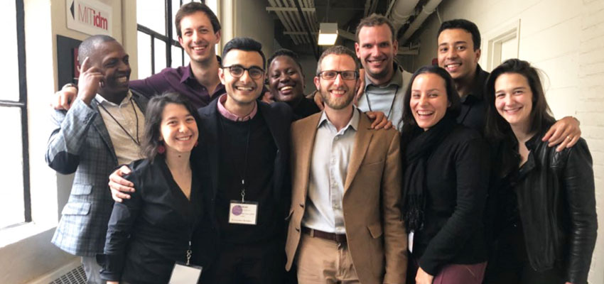 Nine Innovation Ecosystem Builder Fellows at MIT D-Lab — Building N51, Massachusetts Institute of Technology, flanked by the Innovation Ecosystems Manager.