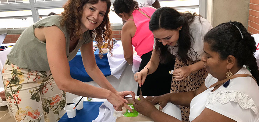 Fall 2018 D-Lab: Gender and Develpment students Anne Thibault (left), an alumna of the Harvard Kennedy School), and Susana Tort (center) who completed her masters degree at MIT in Integrated Design Management in June, and Colombian miner Marta Cecilia Mesia Gomez (right).