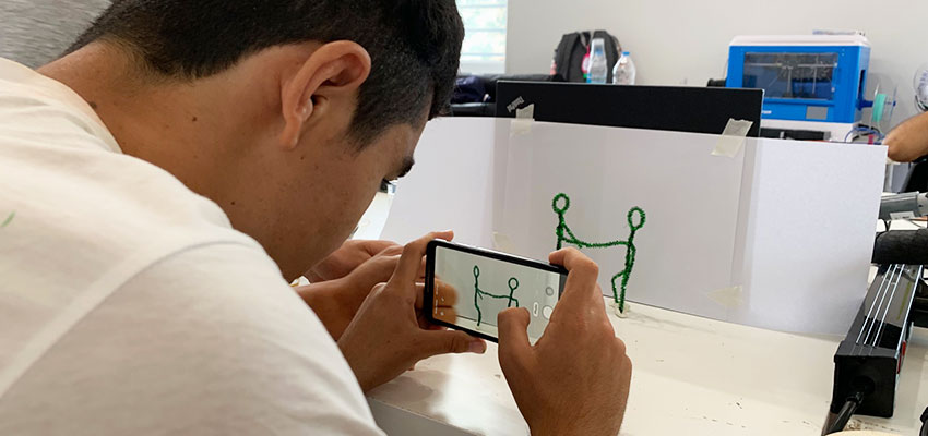 An unaccompanied minor refugee works on creating a stop motion movie for the D-Lab Video Class at the Faros Horizon Boys' Center. Athens, Greece, Summer 2019. Photo: Susana Tort