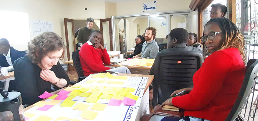 Conducting an all-staff Theory of Change workshop at Ongoza, using concentrated design sprints to rapidly generate the assumptions that can undercut desired impact. Photo: Taylor Light