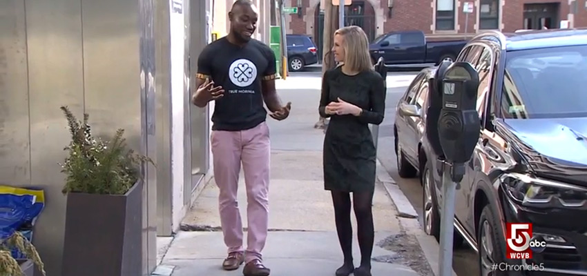 D-Lab alumnus Kwami Williams (left) talking to Chronicle reporter Erika Tarantal in front of D-Lab about True Moringa, the beauty venture he co-founded with D-Lab alumna Emily Cunningham.