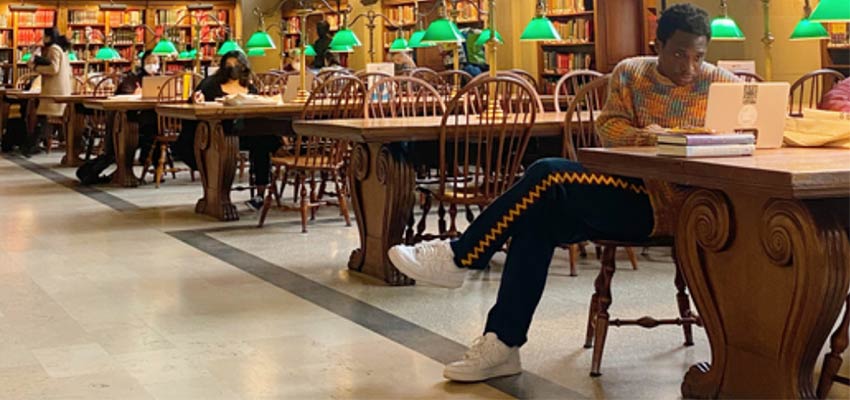 The Boston Public Library has been one of graduate student Milain Fayulu’s favorite places to work on his thesis, which investigates how U.S. venture capital investment in Africa has concentrated in just a handful of nations. Credits: Photo courtesy of Milain Fayulu 
