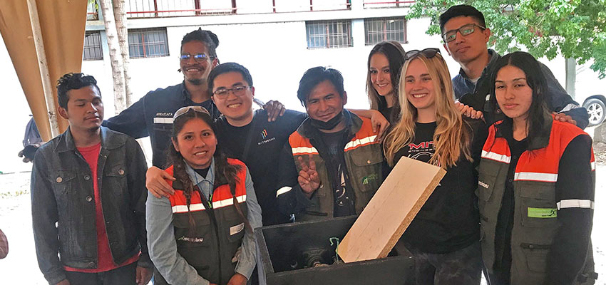 One of seven teams showing the plastic shredder they designed and created during the Creative Capacity Building workshop. The team was comprised of MIT D-Lab students, Bolivian university students, and local waste pickers or ecorecolectoras. Photo: Courtesy MIT D-Lab