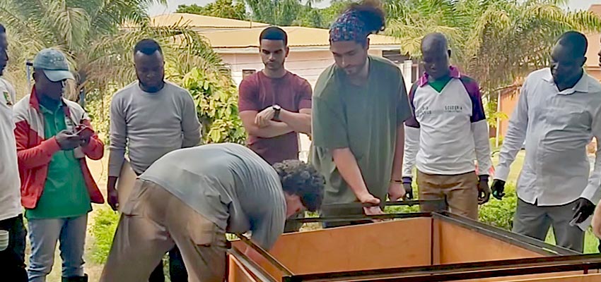 Members of the team working on the thermal box construction for the chick brooder. Photo: African Solar Generation (video capture)