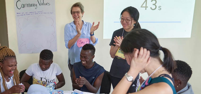 Water bottle challenge with teen parents and SEP Members. D-Lab: Gender and Develpment Co-Instructor Sally Haslanger stands clapping at center. Photo: Courtesy MIT D-Lab