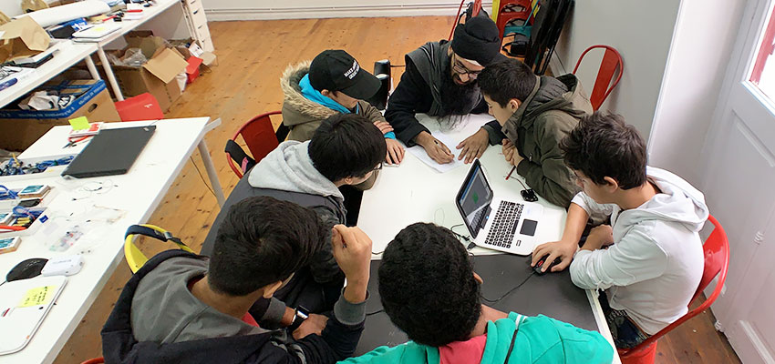 Ivraj teaching students during the lesson on Arduino.