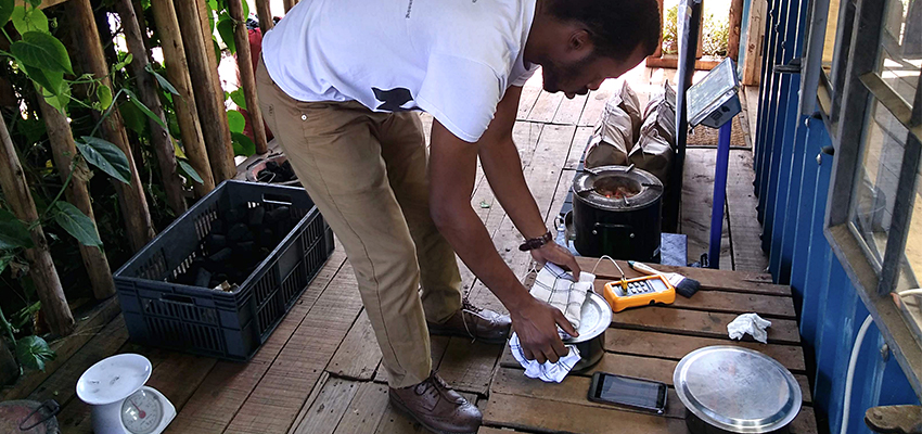 Michael Kitcher (MIT '18) conducts a water boil test at BrightGreen Renewable Energy, Kenya. Photo by Jessica Huang.