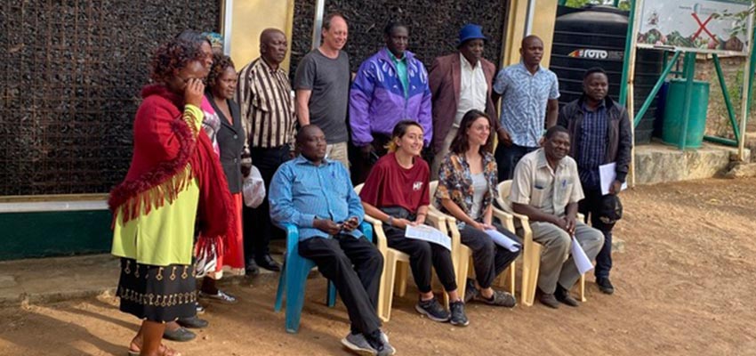 Group of seated and standing people.