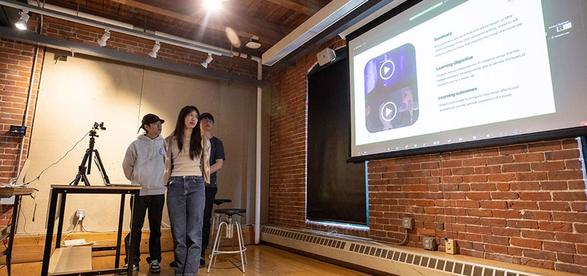 Students present their final designs at crits in an industrial design classroom