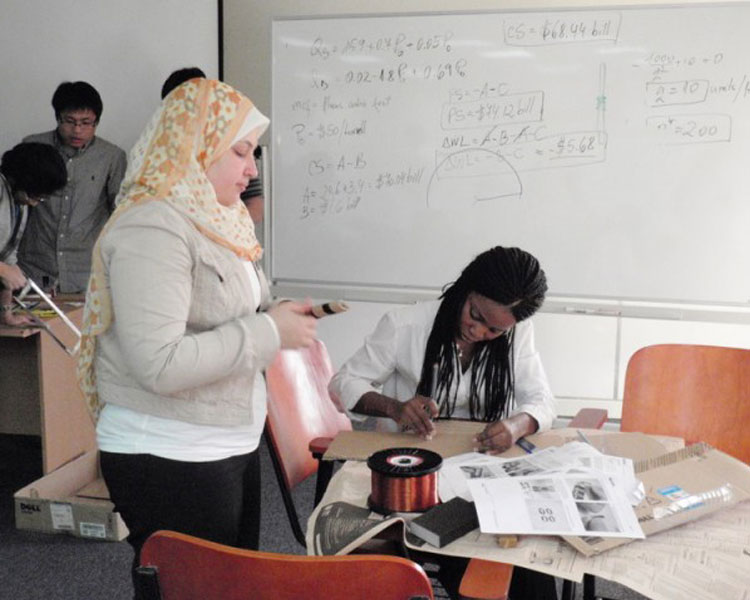 Yomna and Yinka working on the wind lab.