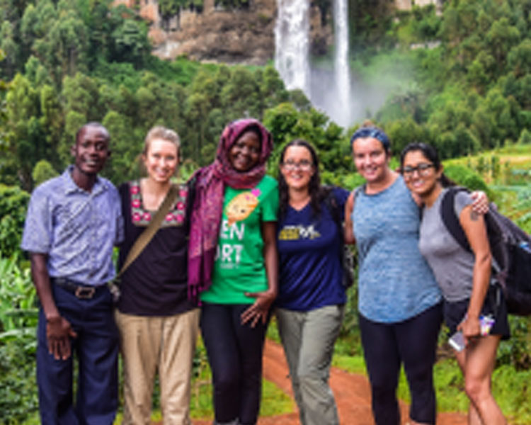 The team visits Sipi Falls (Julia Heyman second from right).