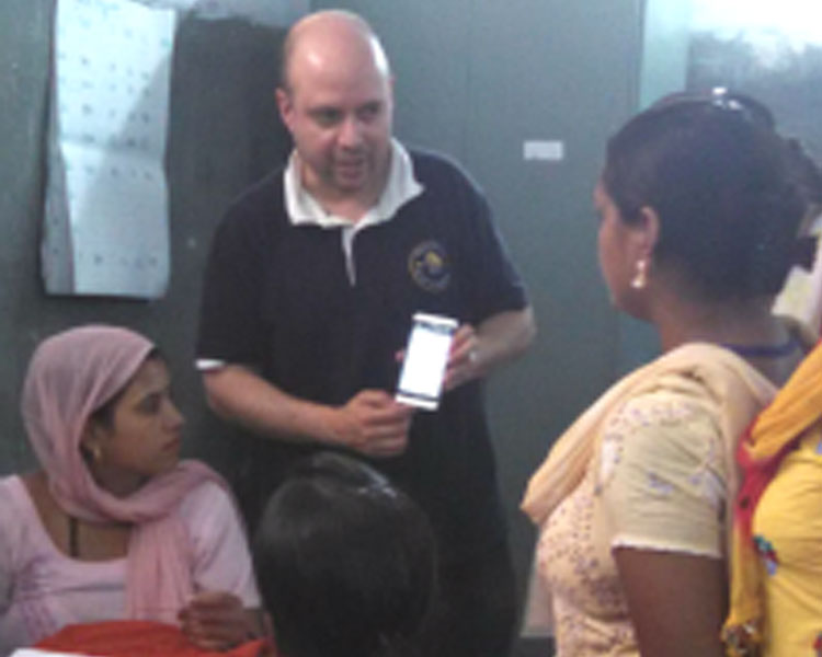 Rich Fletcher of the Mobile Technology Group explaining a phone app to health workers.