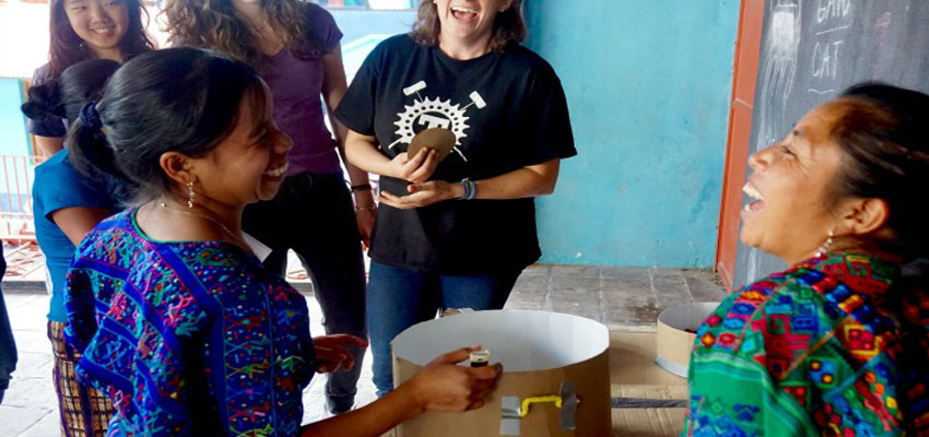 Community leaders Rosa and Maria try out cardboard prototype.