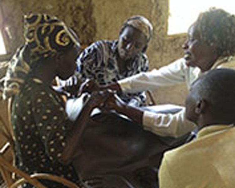 Local men and women in Mitaboni, Kenya participate in a co-design session for water transport solutions