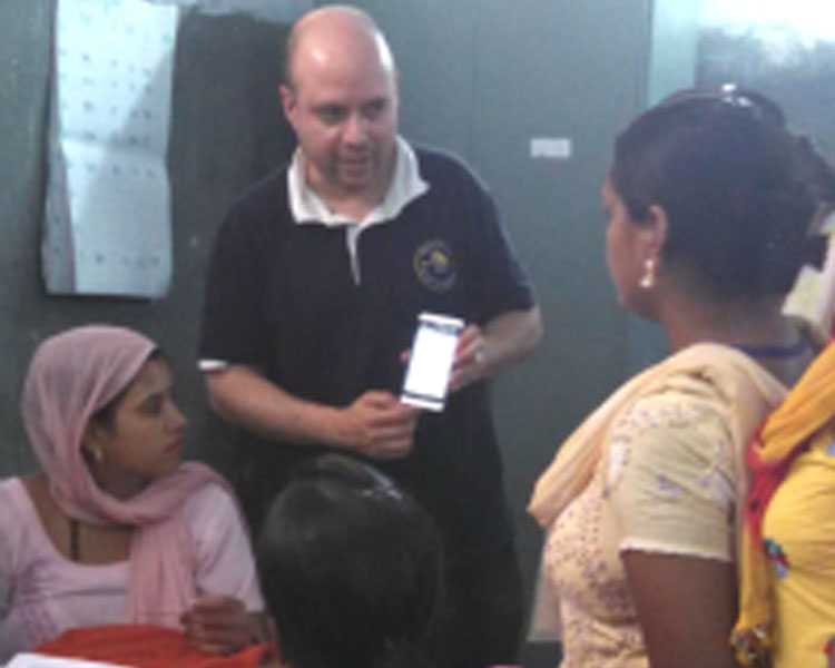 Rich Fletcher of the Mobile Technology Group explaining a phone app to health workers.