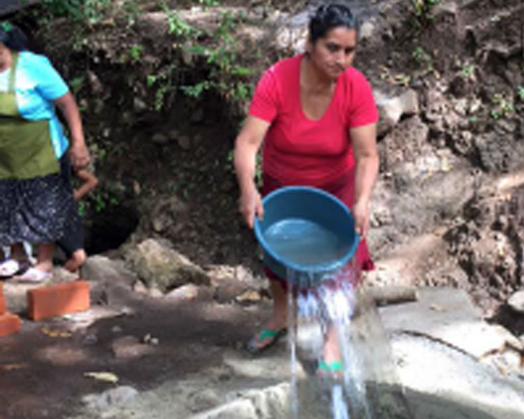 Making cement for the well renovation.