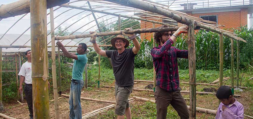 Members of the team working on the roof of the greenhouse. Left to right: Krishna Adhikari, Sanubai, Bob Nanes, Matthew Baldwin, Sanubai’s son.