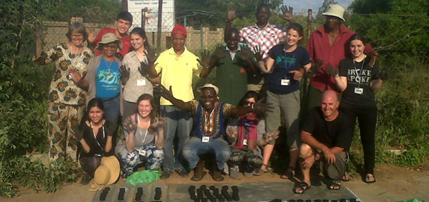 Maddie Hickman (far right, center) with D-Lab founder and co-director Amy Smith (far left), D-Lab: Development students, and community members, Botswana, 2015.