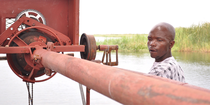 Robert Shimaingo, innovator from Kafue, Zambia, with a prototype of his underwater, dam-free turbine.
