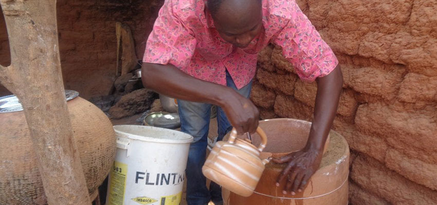 Adding water to an evaporative cooling device.