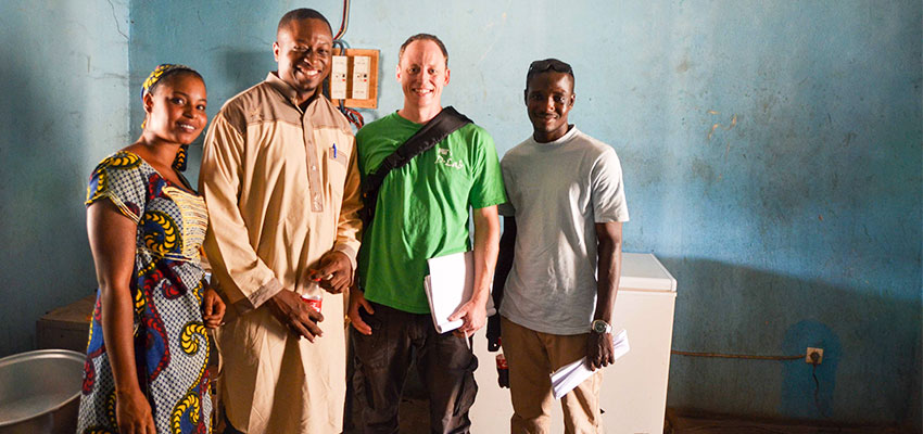 Left to right: A woman who works at a dairy co-operative, Sory Mariko (Mercy Corps), Eric Verploegen (MIt D-Lab), and Abdoulaye Coulibaly (translator). 
