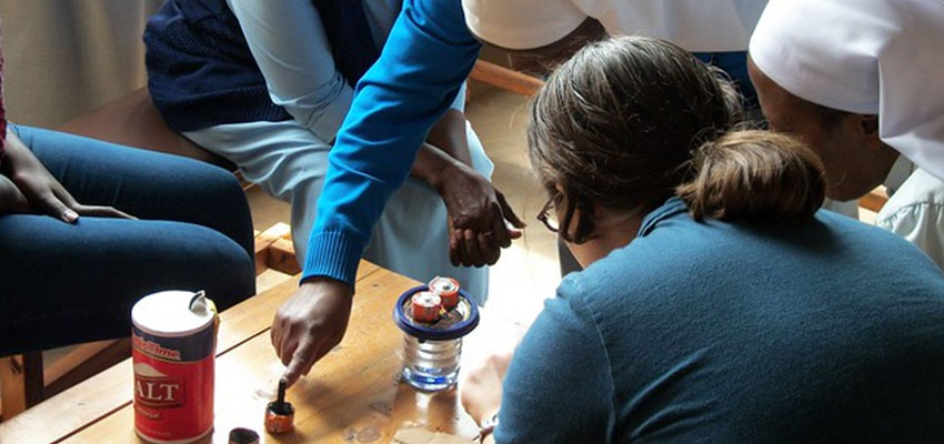 Teaching the Benebikira sisters how to generate chlorine from graphite batteries, salt, and water. January 2011. Photo credit: Nse Umoh