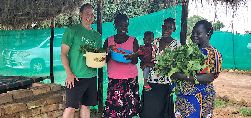 From left: D-Lab Research Engineer Eric Verploegen, founder of AEST Betty Ikalany, and vegetable vendors Agnes Irasu and Tabitha Ajuro.