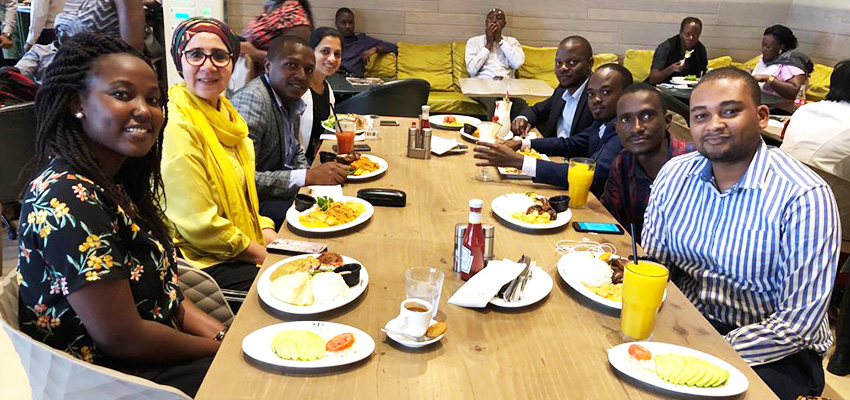 The author's extended social enterprise team at a group lunch, after an exhilarating day of customer conversations.