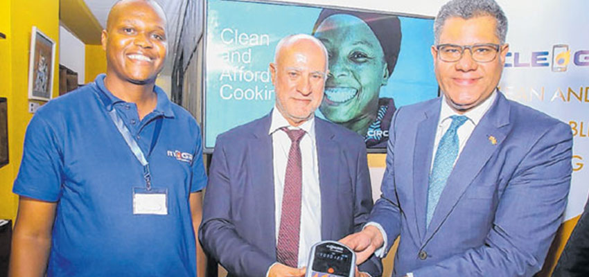 From right are, International Development Secretary United Kingdom, Mr Alok Sharma and   Safaricom Plc Chief Executives officer, Michael Joseph displays Pay-As-You-Go clean gas technology during the acquisition of Kopagas proprietary technology to UK Company during an event held in Nairobi Kenya. Looking on is Mr Andron Mendes inventor of Pay-As-You-Go clean gas technology. 