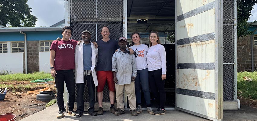  The team in front of the finished chamber.  From left to right: Alex Encinas, Mwachoni El-Yahkim, Eric Verploegen, Boniface Manambo, Christine Padalino, Maddy Bundy.
