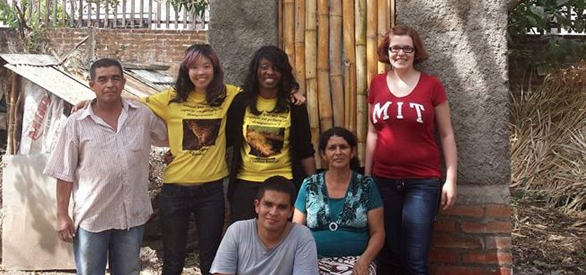 Elaine Kung '15 (second from left) and D-Lab instructor Libby Hsu (far right) with other members of the MIT and Salvadoran team in front of a newly completed compost toilet. In August, with support from MIT Tau Beta Pi, Kung will continue work she began with a D-Lab team on the redesign of a compost toilet for the Salvadoran rural health organization ASAPROSAR. Photo: Courtesy of MIT D-Lab. 