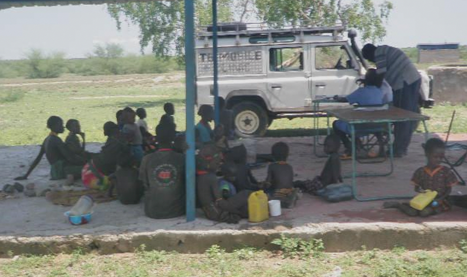 Turkana Basin Institute mobile clinic staff attending to women and children.