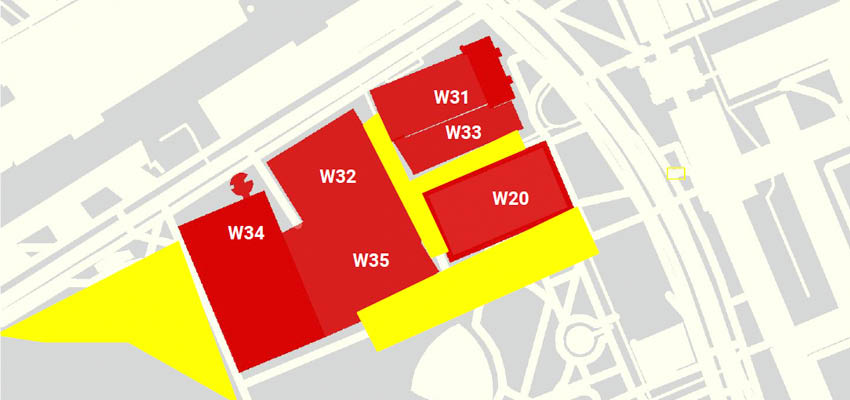 Available spaces for geothermal exchange and thermal storage installation. Red: Buildings. Yellow: Available Space. Grey: MIT campus.
