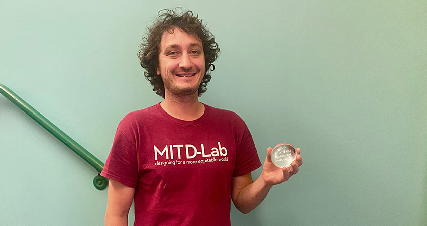 D-Lab Research Scientist Dan Sweeney with his Infinte Mile Award from the MIT School of Architecture and Planning. Photo: MIT D-Lab