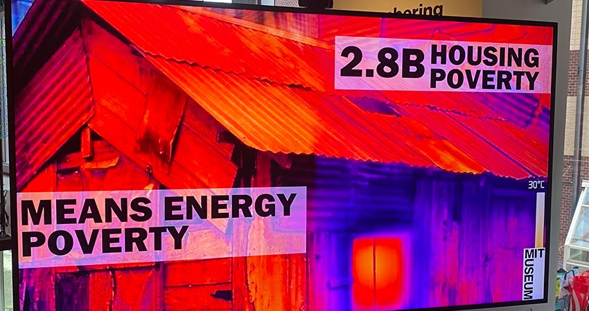 Screen with image of wooden house.