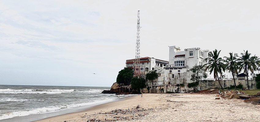 White castle at the end of a beach.