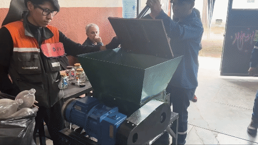 Demonstration of a platic bottle compactor.