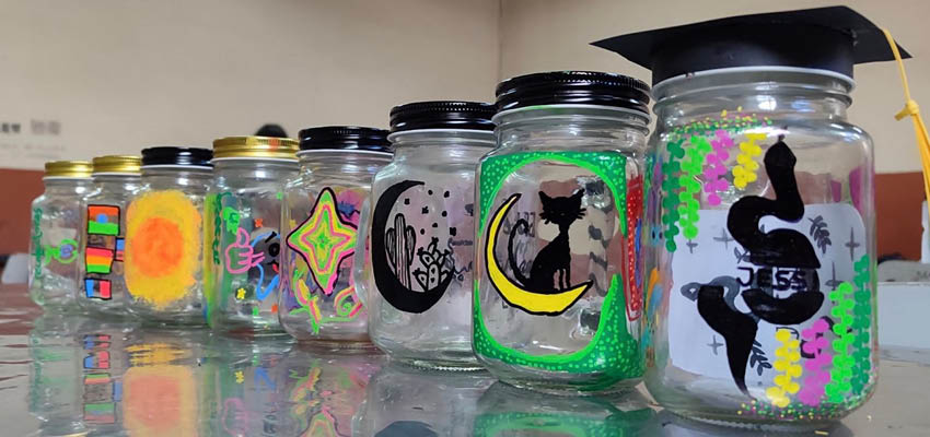 8 festively painted clear glass jars.