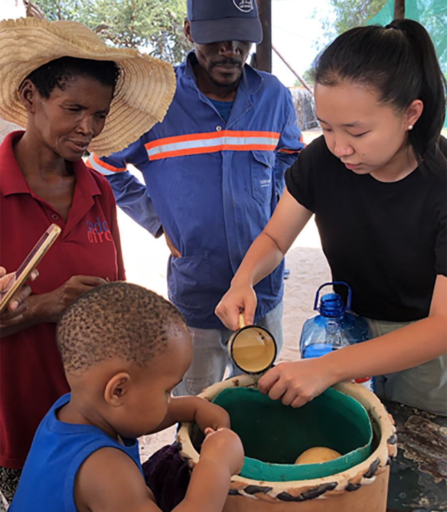 D-Lab student Anna creating a clay pot evaporative cooler