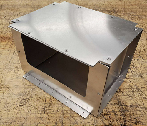 Figure 2: Housing made from bent sheet aluminum.  All of the fasteners for this product are on the outside of the box to keep the inside free from blemishes through the manufacturing process.  Moreover, this allows for the design to be more light-tight.   