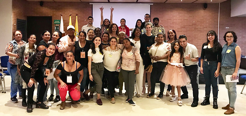 Large standing group of D-Lab: Gender women and local women