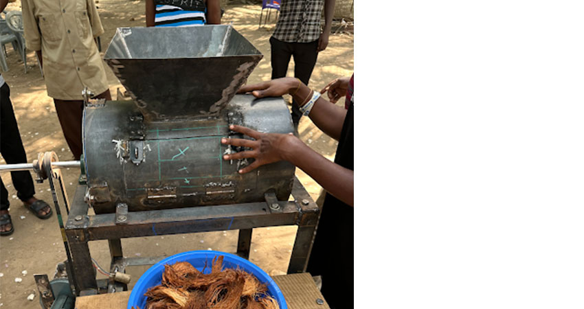 Metal machine on a table outside.