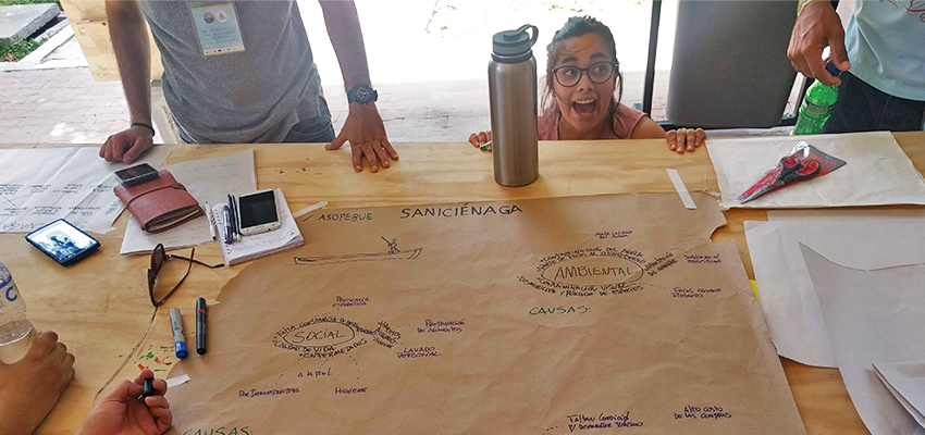 Team SaniCiénaga’s problem framing exercise. Team member Alejandra Villagrán Hernández says that visiting the community before framing the problem allowed her to “visualize the social dynamics and analyze shared habits.”
